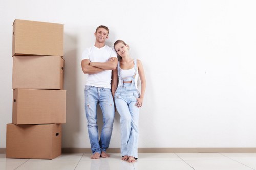 Man and van removals team loading furniture in Homerton