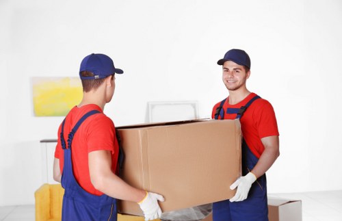 A Homerton moving team handling boxes and furniture for a local customer