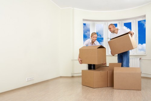Local house removals team working in Homerton with moving van and boxes