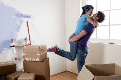 Removal van and moving team in a Homerton street