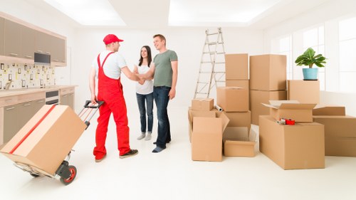 Packed household items prepared for transport by a removal van