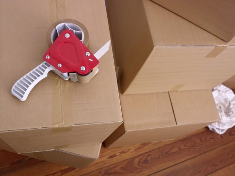 A small team moving household items from a flat in Homerton